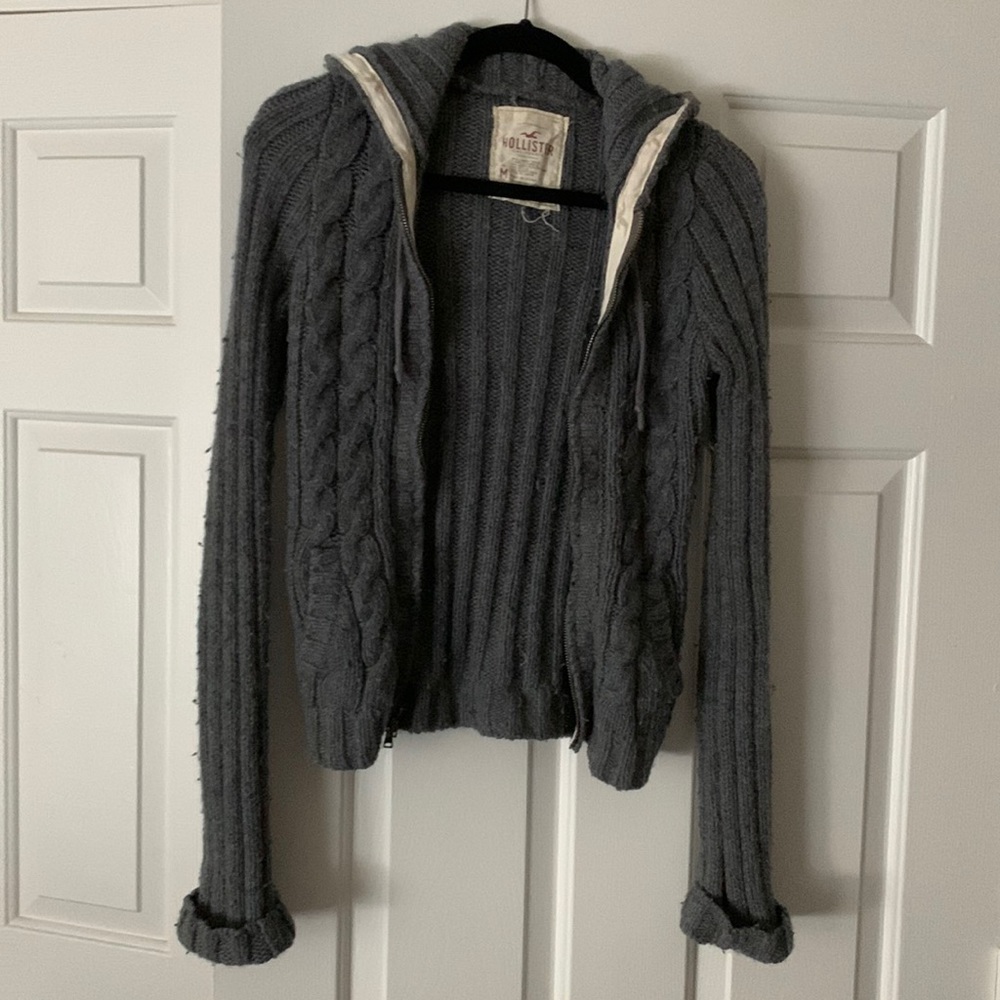 Grey hooded zip up sweater with pockets